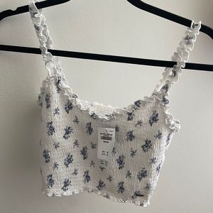 white and blue flowered crop tank